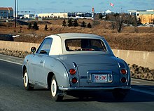 A Dealer plate is affixed only to the rear of a vehicle. Ontario Dealer License Plate on 1991 Nissan Figaro (5564006773) (cropped).jpg