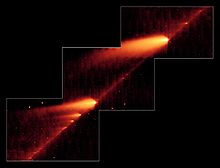 Infrared image from NASA's Spitzer Space Telescope showing the broken comet 73P/Schwassmann-Wachmann 3 that follows the trail of debris left during its multiple trips around the Sun PIA08452.jpg