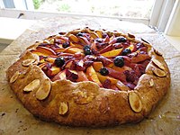 Peach, blueberry, and alpine strawberry galette