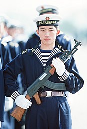 People's Liberation Army Navy sailor with type 56 assault rifle.jpeg