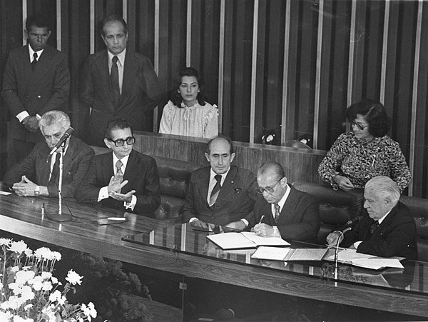 Figueiredo signs official documents during his inauguration ceremony in the National Congress, 15 March 1979