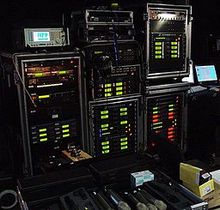 Wireless microphone receiver racks backstage at a large televised music awards event Radio mic racks1.JPG