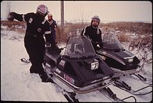Snowmobile drivers wearing snowmobile suits in Minnesota. SNOWMOBILING IS A POPULAR WINTER PASTIME FOR YOUNG AND OLD ALIKE AROUND NEW ULM, MINNESOTA. ALL IT TAKES IS SNOW AND... - NARA - 558246.jpg