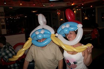 English: Balloon parody hats of Poppa Smurf an...