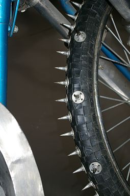 Studded front tyre with spikes used on Ice speedway Spikes-Rennmotorrad.jpg