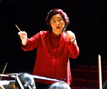 Apo Hsu, using a baton, conducts the NTNU Symphony Orchestra in Taipei, Republic of China