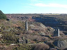 The engine house and chimney at the old Blue Hills Mine, Wheal Kitty The engine house and chimney at Blue Hills Mine - geograph.org.uk - 2243564.jpg