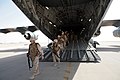US Navy 080922-N-9623R-052 Seabees exit an Air Force transport aircraft.jpg