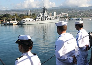 US Navy 120123-N-BK435-088 Sailors assigned to the submarine tender USS Frank Cable (AS 40) man the rails as the ship passes the historic USS Misso.jpg