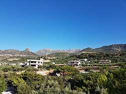 View of the easternmost part of Fermas, in the background the foothills of the Thripti Mountains