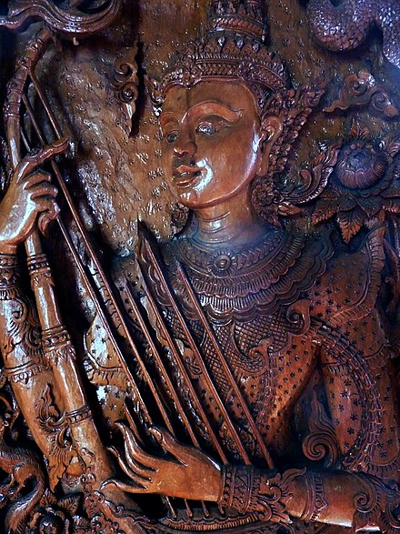 Wood carving of a gandharva, Thailand.