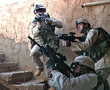 Soldiers from 1st Infantry Division clearing a building in Fallujah, 19 November 2004. 1st Inf Div Faludza.jpg