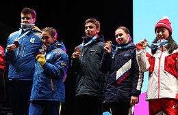 Levandi (center) on the podium at the 2020 Winter Youth Olympics 2020-01-15 Medals Ceremonies (2020 Winter Youth Olympics) by Sandro Halank-196.jpg