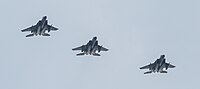 A formation of three F-15C/D Eagles overhead Kadena Air Base in Okinawa, Japan. The aircraft are assigned to the 18th Wing.