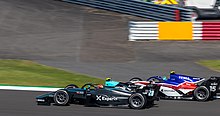 Deledda (car in front) driving the Dallara F2 2018 at the 2021 Silverstone Formula 2 round 2021 British Grand Prix (51348542457).jpg