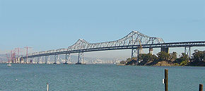 Construction on the skyway in progress at left in 2004, with main span counterweight support columns in place at right of center 800px-EasternSFOBBSkyExt.jpg