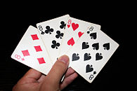 Mano de cartas de póker con los cuatro 8 de la baraja.