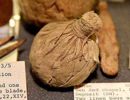 A bag of white linen, unopened. Contains rolls of linen. Foundation deposit, Heb Sed Chapel at Lahun, Faiyum, Egypt. 12th Dynasty. The Petrie Museum of Egyptian Archaeology, London.