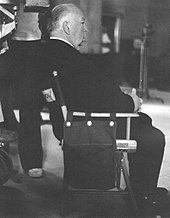 Image of Hitchcock seated during the filming of Family Plot