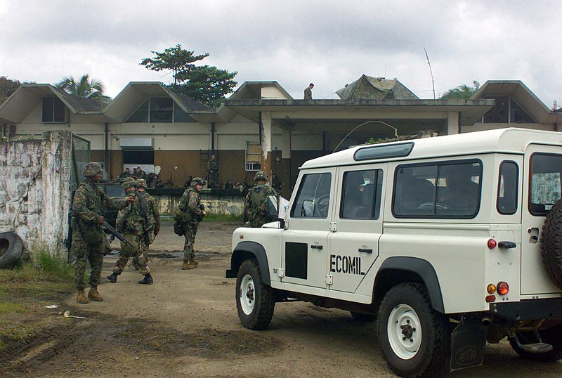 File:An ECOMIL (Ecowas Mission in Liberia) Economic Community of West African States (ECOWAS), Landrover Vehicle enters a compound controlled by US Marine Corps (USMC) assigned to Lima-B - DPLA - 2fd69242eeb244c9d485fef6e203bedd.jpeg