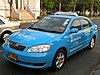 A corporate metered taxi