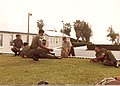 A Permanent Staff Instructor (PSI) with senior Non-Commissioned Officers of the Bermuda Regiment.