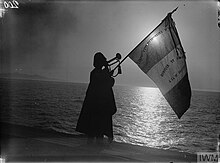 Bugler of the Corps Expeditionaire d'Orient sounding a call at sunset on a French transport ship - 1915 Bugler of the Corps Expeditionaire d'Orient sounding a call at sunset on a French transport ship 1915.jpg