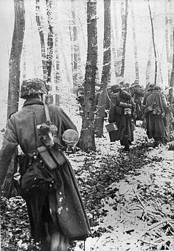 German infantry traveling on foot in the Ardennes, December 1944