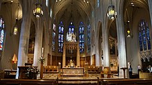 Italian marble built in a trompe-l'oeil style is used around the altar. Cathedral Basilica of Christ the King Interior - Hamilton, ON.jpg