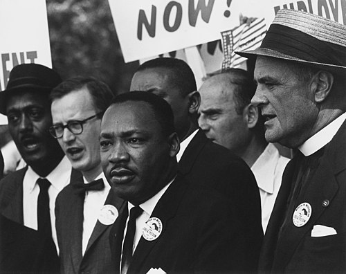 Martin Luther King Jr. (center), one of many 20th century political figures who considered it important to fight hunger: "When I die, don't build a monument to me. Don't bestow me degrees from great universities. Just clothe the naked. Say that I tried to house the homeless. Let people say that I tried to feed the hungry."[1]