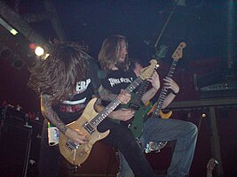Darkest Hour live in Barcelona in 2009. From left to right: Mike Schleibaum, Mike Carrigan and Paul Burnette.