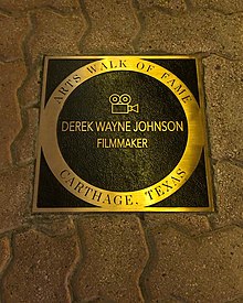 Johnson's plaque on the Carthage Main Street Arts Walk of Fame Derek Wayne Johnson - Carthage Main Street Arts Walk of Fame - Esquire Theater - 2022.jpg