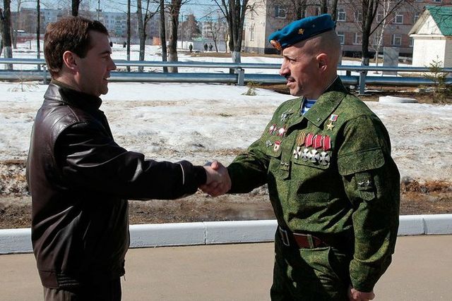 Lt. Col. Lebed, Hero of Russia, Knight of the Order of St. George 4th class and 3 time recipient of the Order of Courage, greeting Russian President M