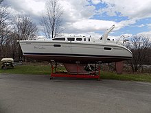 Hunter 310 on its cradle, showing the keel and rudder configuration Hunter 310 sailboat 2388.jpg