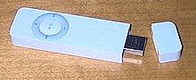 First-generation iPod Shuffle with the cap removed to show the USB connector. The cap snaps onto the unit. The iPod Shuffle comes with a second cap on a lanyard, which a user can wear around their neck. Ipod-shuffle-usb-connector.jpg