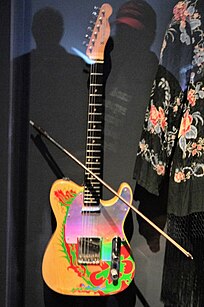Page's Dragon Telecaster with a violin bow Jimmy Page's Dragon Telecaster (1959 Fender, serial no. 50062), received from Jeff Beck ca.1965, hand painted & replaced the pickguard by Jimmy Page, played with violin bow - Play It Loud. MET (2019-05-13 19.27.12 by Eden, Janine and Jim).jpg