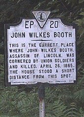 The Historic Site marker on U.S. Route 301 near Port Royal, where the Garrett barn and farmhouse once stood in what is now the highway's median (2007)