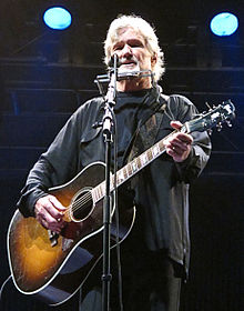 Kris Kristofferson with his reissue (or original) round shouldered SJ in Munich, 2010 Kris Kristofferson 2010 Munich, Germany, Tollwood.JPG