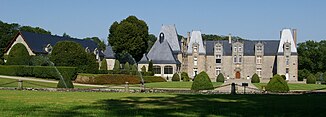 Castle on the riverside at Saint-Ouën-des-Vallons