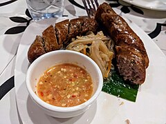 Grilled sai oua sausage with a chilli-garlic-fish sauce dip