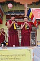 Monks playing Dungchens in front of Soma Gompa in Leh after Prayer / Ladakh, India