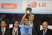 Blatter (right) with Luis Suarez, the Player of the Tournament of the 2011 Copa America. Luis Suarez - CA2011 mvp award.jpg