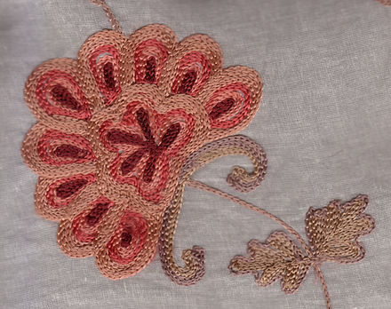 Commercial machine embroidery in chain stitch on a voile curtain, China, early 21st century.