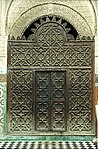 Wooden mashrabiya screen at the entrance of the courtyard