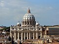 St. Peter's basilica in Vatican City, with a dome, seen from outside.