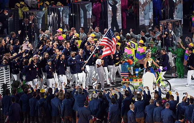 Michael Phelps carrying the flag on behalf of athletes from the United States