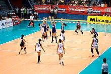 A women's volleyball match in the Shakey's V-League. (now Premier Volleyball League) Philippine Army takes game one of Shakeys V-League Volleyball finals against San Sebastian College. (6163011624).jpg