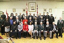 Recipients of the Queen Elizabeth II Diamond Jubilee Medal and Canadian MP Rathika Sitsabaiesan after the medal's presentation ceremony in Toronto. Rathika Sitsabaiesan with receipients of the Queen Elizabeth II Diamond Jubilee medals.jpg