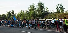 Migrants walking along the motorway from Hungary to Austria, 4 September 2015 Refugee march Hungary 2015-09-04 02 B.jpg