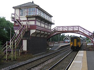 Pedestrian bridge and signal box from 1901 at Haltwhistle stop